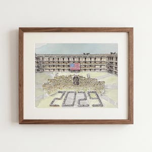May include: Watercolor print of a building with an American flag, framed in a brown wooden frame. The image depicts a large group of people in formation, with the number "2029" at the bottom. The artwork is a detailed illustration.