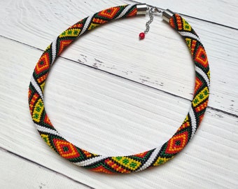 Bright three-dimensional necklace with geometric ornament. Ukrainian motifs. Handmade beaded knitted necklace. Ukrainian embroidery necklace