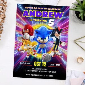 May include: A colorful birthday party invitation featuring Sonic the Hedgehog and friends. The invitation includes the name "ANDREW", the number "5", and the date "OCT 12". The text "GOTTA GO FAST TO CELEBRATE!" is at the top.