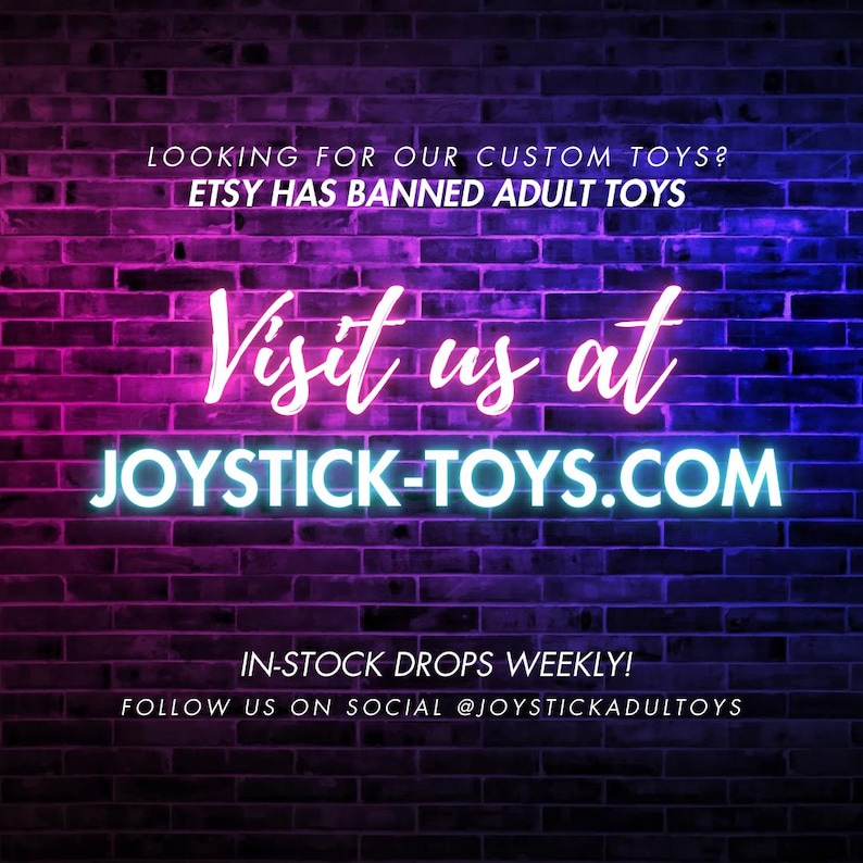 May include: Neon sign on a brick wall that reads "Visit us at JOYSTICK-TOYS.COM". The text is in pink and blue neon lights. The text "LOOKING FOR OUR CUSTOM TOYS? ETSY HAS BANNED ADULT TOYS" is above the neon sign in white text. The text "IN-STOCK DROPS WEEKLY! FOLLOW US ON SOCIAL @JOYSTICKADULTOYS" is below the neon sign in white text.