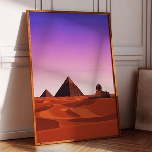 May include: A framed print depicting a desert landscape with three pyramids and the Sphinx in the distance. The sky is a gradient of purple and pink.