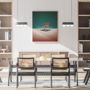 May include: A dining room with a glass table and six chairs. The chairs are black with woven cane seats. There are two bookshelves on either side of the room, and a framed print of a red, yellow, and blue chair on a teal background hangs on the wall above the table.