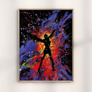 Puede incluir: Impresión artística abstracta que presenta una figura silueteada con los brazos extendidos, sobre una explosión vibrante de color. La obra utiliza una paleta de rojo, azul, amarillo y blanco sobre un fondo negro, enmarcada en madera clara.