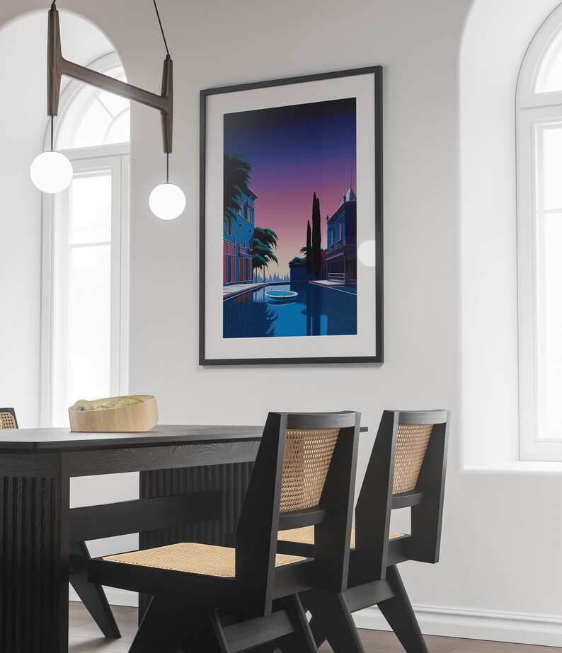 May include: A framed print of a colorful illustration depicting a canal scene with buildings, trees, and a boat. The scene is set at dusk with a purple and pink sky.