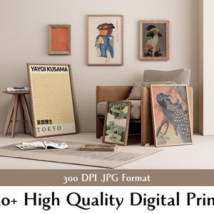 May include: A collection of framed prints featuring various Japanese art and designs. The prints include a geometric pattern, a traditional Japanese painting of a bird, and a painting of a peacock. The prints are displayed on a wall in a modern living room setting.