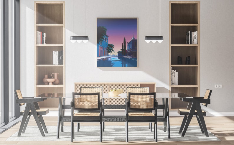 May include: A dining room with a glass table and six black chairs with woven cane seats. The table is set with a bowl of fruit. There are two wooden bookshelves on either side of the room, and a large framed print of a cityscape with a canal hanging on the wall.