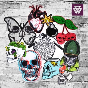 May include: A selection of embroidered patches, including skull designs, a butterfly skull, a human heart, a bomb, and cherries. Other patches feature a brain, a skull with a fishbowl, a skull in a military hat, and a lighter with the text "BURN IT ALL".