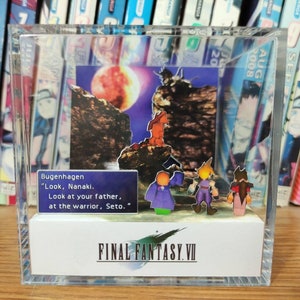 May include: A clear acrylic display case with a miniature diorama of characters from the video game Final Fantasy VII. The diorama features a red moon, a rocky cliff, and four characters standing on a platform. The text "Bugenhagen "Look, Nanaki. Look at your father, at the warrior, Seto." is displayed on a blue screen. The case has a white base with the text "FINAL FANTASY VII" printed on it.