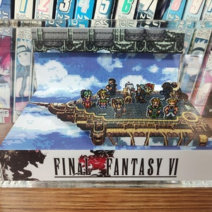 May include: A 3D diorama of the airship from Final Fantasy VI, featuring the main characters in pixelated form. The diorama is displayed in a clear acrylic case.