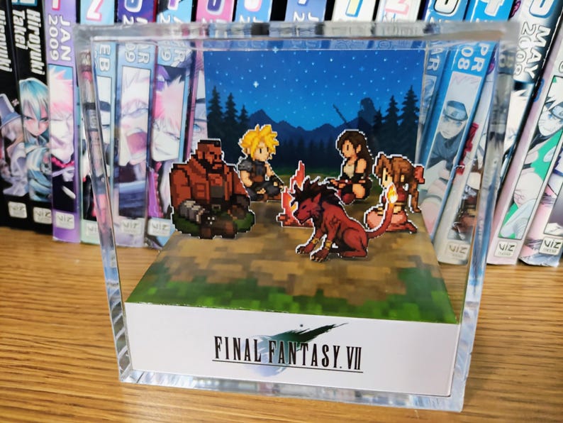May include: A Final Fantasy VII pixel art diorama. The scene shows a campfire with characters, set against a starry night backdrop. The diorama is encased in a clear acrylic box, with the game's logo at the base. A great gift for gamers.