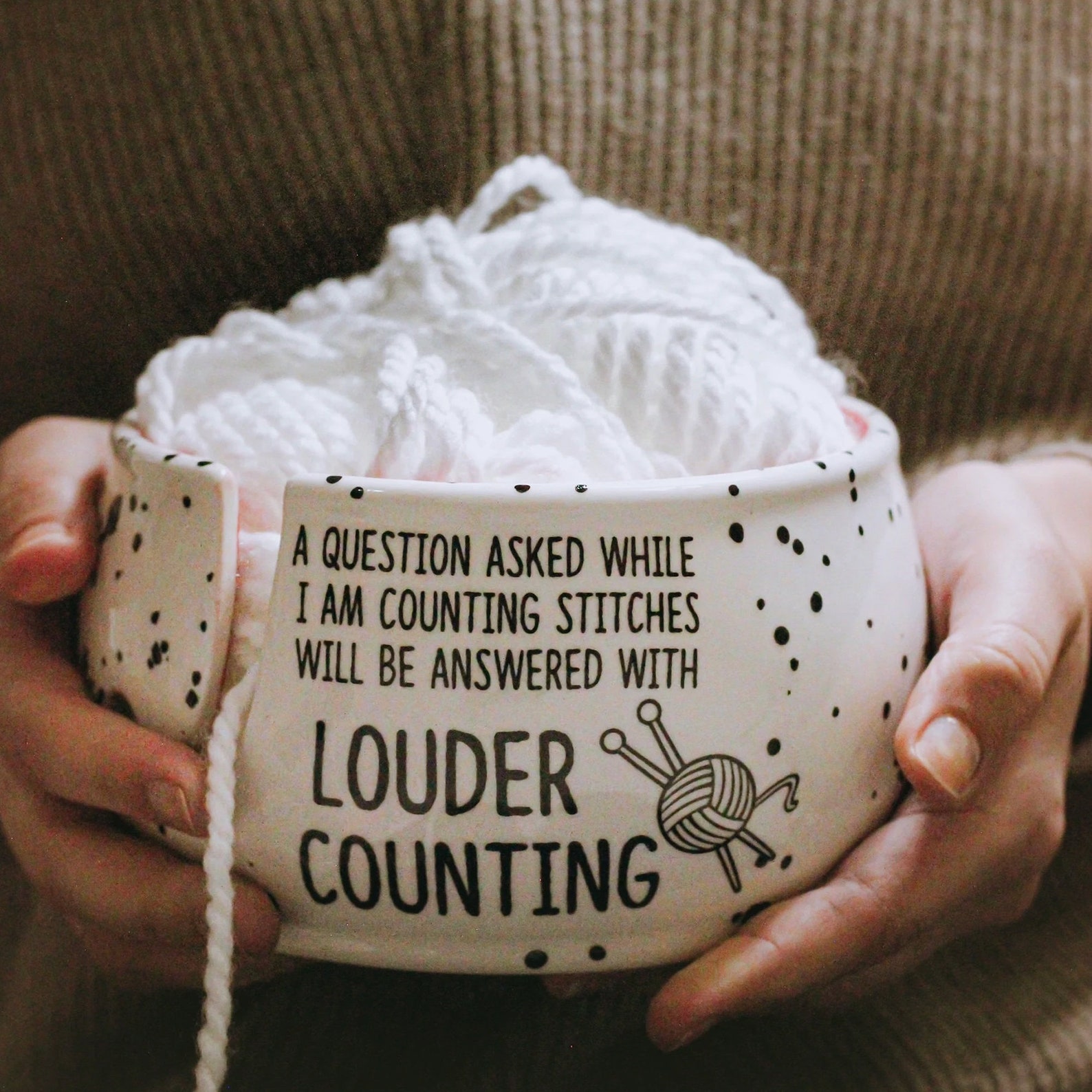 funny yarn bowl with saying 'a question asked while coutning stitches will be answered with louder counitng'