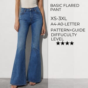 May include: Blue denim flared trousers with a high-waisted fit. Text on the right reads: BASIC FLARED PANT, XS-3XL, A4-A0-LETTER, PATTERN+GUIDE, DIFFICULTY LEVEL, and four black stars. The trousers feature a classic five-pocket design and a button closure.