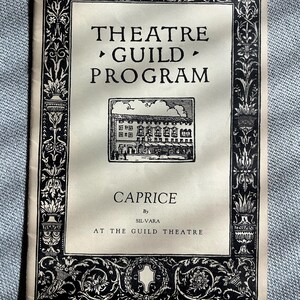 May include: A vintage Theatre Guild Program, featuring the play "Caprice" by Sil-Vara, at The Guild Theatre. The program has a black and white floral border and a drawing of a building. The program's text is in black.