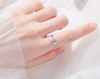 diamond ring in index finger