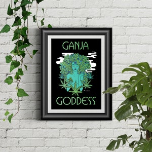 May include: A framed print with a black background and green text that reads "GANJA GODDESS". The image features a green and blue woman with long hair, surrounded by green marijuana leaves.