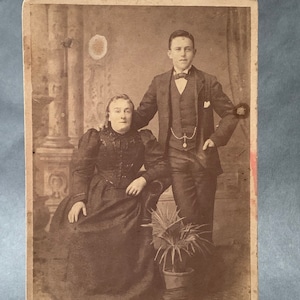 Larger Antique Victorian era photograph studio portrait of well-dressed man and woman 16.5cm x 10.7cm Australia late 1800s early 1900s