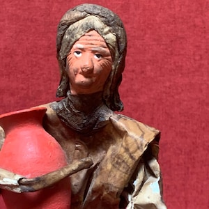 Mexican Folk Art Paper Mache Sculpture of an Elderly Woman carrying terracotta vase and dish 31cm