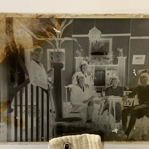 Antique Dry Plate Glass Negative with image of a family posing in the sitting room