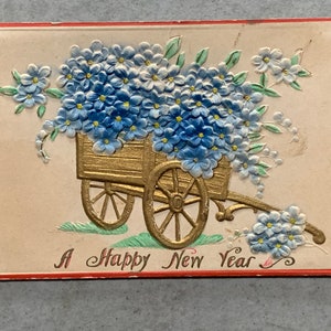 Antique Postcard A Happy New Year embossed design wagon of blue flowers handwritten message Dear Robert