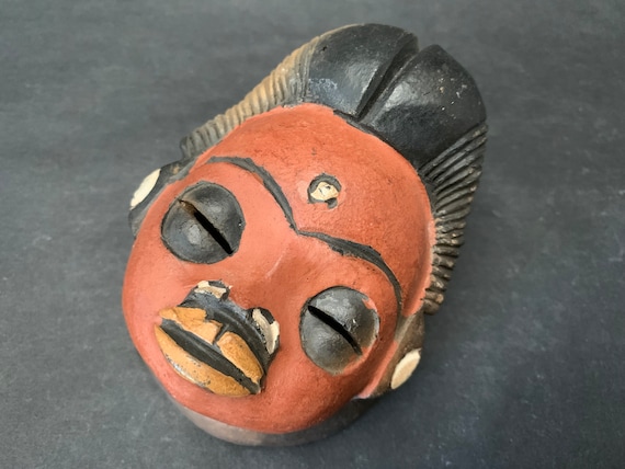 A rare handmade terracotta Punu head from Gabon — a genuine ethnographic curiosity and sculptural conversation piece, not a reproduction.