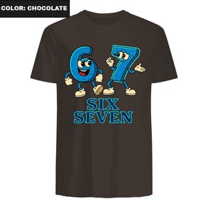 May include: Chocolate brown t-shirt featuring a cartoon graphic of the numbers six and seven with arms and legs. The numbers are blue with white accents and the text "SIX SEVEN" in blue below.