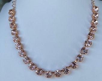 Swarovski crystal Anna Wintour tennis style necklace in vintage rose pink and rose gold plated setting. See description