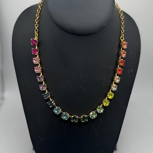 Swarovski crystal Anna statement tennis necklace in rainbow pride crystal gold plated cup chain setting.