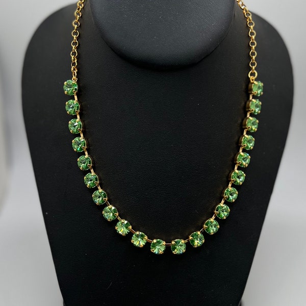 Peridot Swarovski crystal Anna Wintour tennis necklace in gold plated setting.