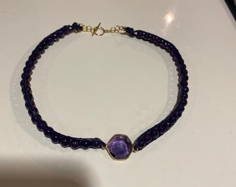 Amethyst and leather choker with gorgeous 14k gold filled bezel set amethyst focal stone. Finished with gold filled toggle clasp.