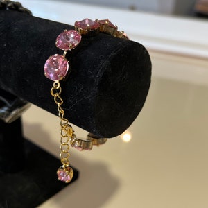 Swarovski crystal tennis bracelet Anna Wintour style in light pink 12mm rivoli gold plated cup chain.