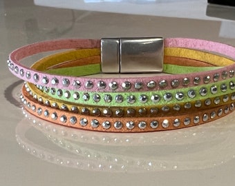 Faux suede bracelet multi strand silver studded in pastel spring colors green orange pink and yellow with silver clasp.