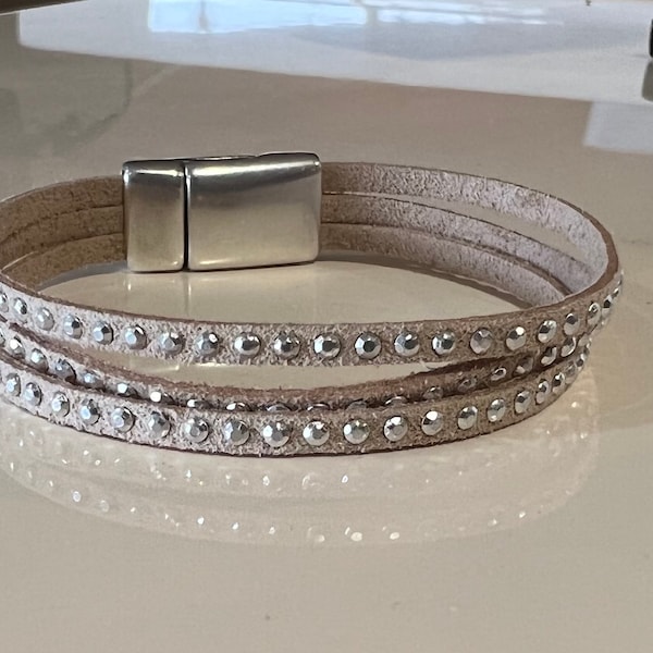 Faux suede bracelet multi strand silver studded in beige with silver clasp.