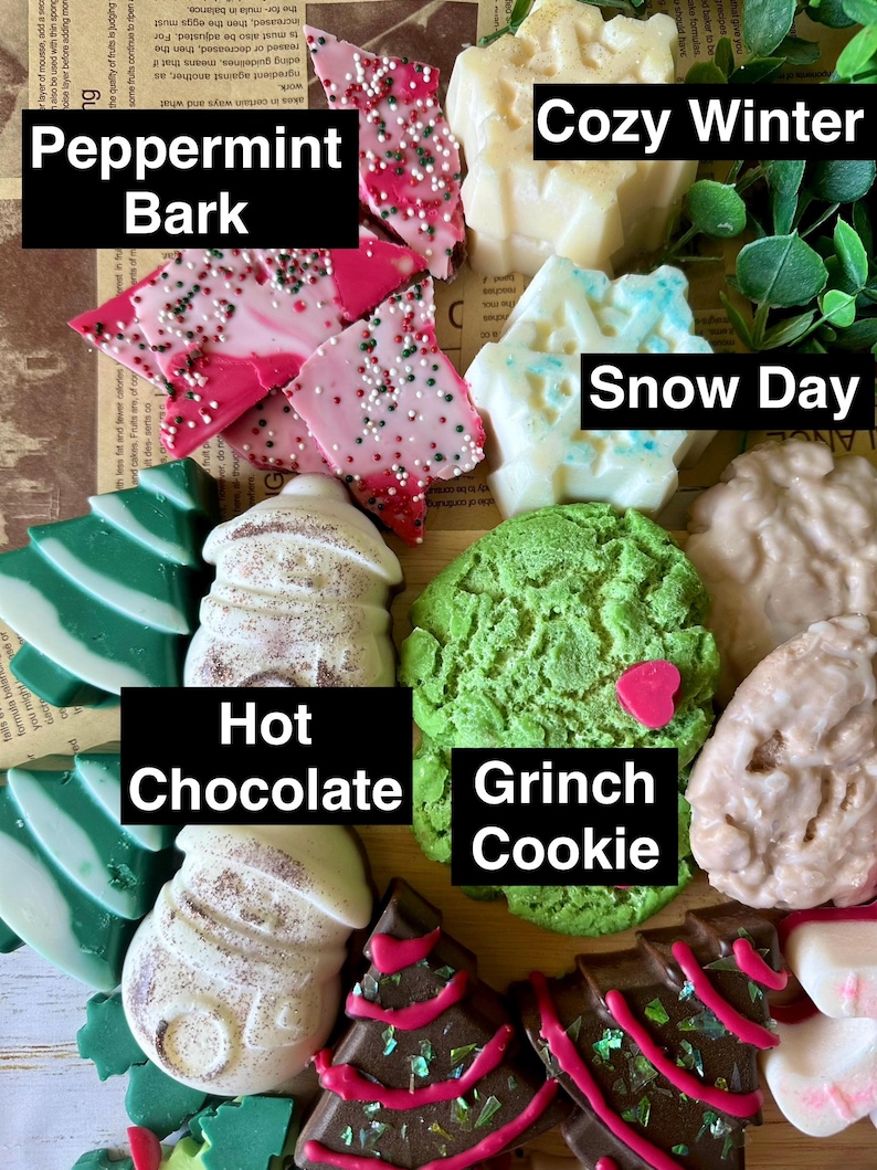 May include: A collection of festive, decorative soaps in various shapes and colors. The soaps include peppermint bark, Christmas trees, snow day, hot chocolate, Grinch cookie, and cozy winter designs. The image includes the text "Peppermint Bark", "Cozy Winter", "Snow Day", "Hot Chocolate", and "Grinch Cookie".