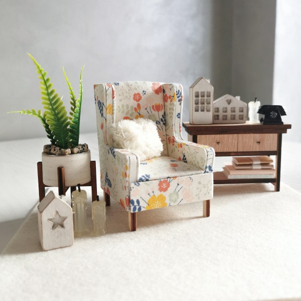 Scale 1/12. Miniature small armchair with a delicate pattern on the upholstery. Mini dollhouse chair.