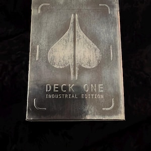 May include: A set of three ceramic mugs with a speckled, matte finish. The mugs are in shades of cream, light gray, and dark gray. Each mug has a simple, minimalist design, perfect for coffee or tea.