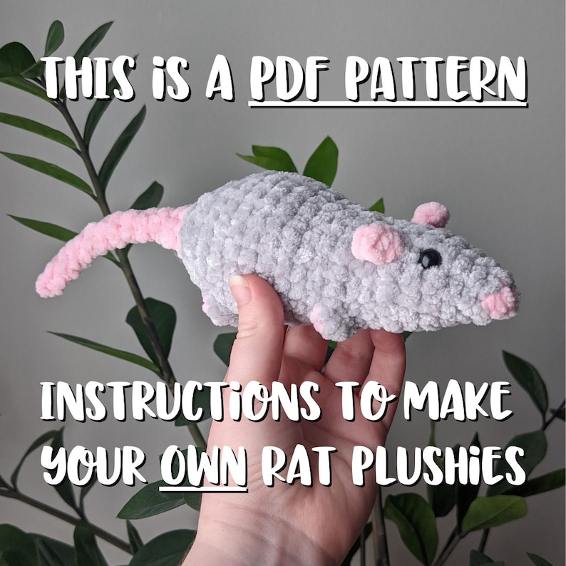 A hand holding up a gray crocheted rat plushie with pink nose, ears, and tail. The text on the image reads 'This is a PDF pattern', and 'Instructions to make your own rat plushies'.