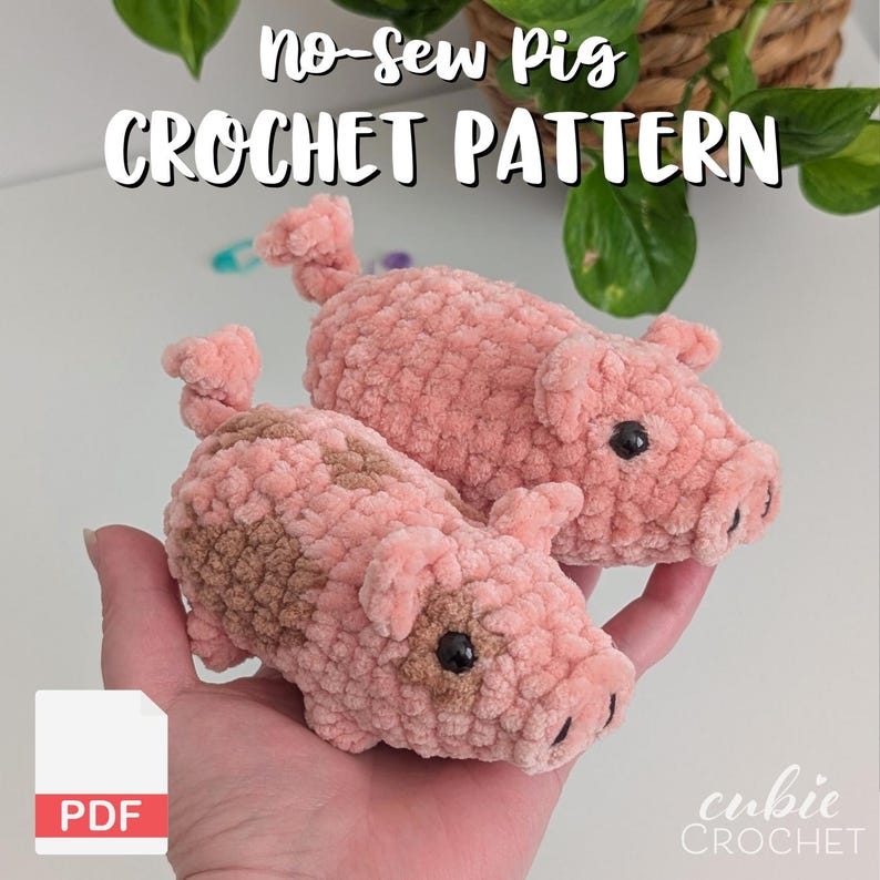 May include: Two plush pig figures made of soft pink yarn with a curly tail, small ears, and black bead eyes. One pig features brown patches. The text reads No-Sew Pig CROCHET PATTERN and PDF. The design is a handmade stuffed animal toy.