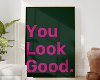 May include: A framed poster with a dark green background and the text "You Look Good." in pink.