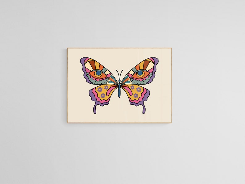 May include: A colorful butterfly with large eyes and intricate patterns on its wings. The butterfly is a vibrant mix of pink, yellow, orange, and blue.