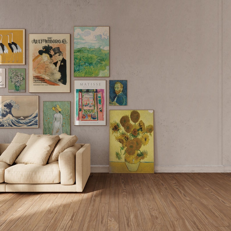May include: A living room with a beige couch and a wall decorated with various framed artwork. The artwork includes a painting of a wave, a painting of a landscape, a painting of a couple, a painting of a window, a painting of a man, and a painting of sunflowers.