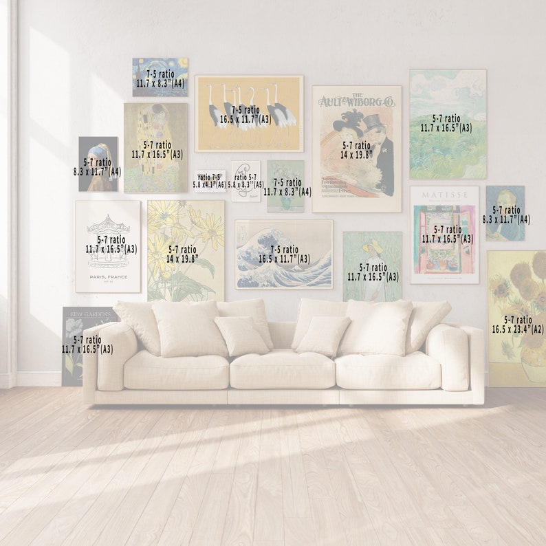 May include: A living room interior with a white couch and a gallery wall of framed art prints. The prints feature various subjects, including a carousel, sunflowers, a wave, and a woman in a hat. The prints are in different sizes and ratios, including 5:7, 7:5, and 14 x 19.8 inches.