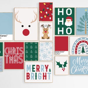 May include: A collection of 12 Christmas-themed printable wall art prints. The prints feature various designs, including a reindeer, a snowman, a Christmas tree, candy canes, snowflakes, and text that says "Merry & Bright", "Ho Ho Ho", "Chris Tmas", and "Merry Christmas".