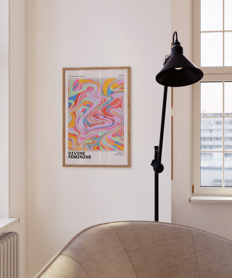 May include: A framed print with a colorful abstract design in shades of pink, blue, green, yellow, and orange. The print is titled "Divine Feminine" and is part of the "Psychedelic Series".