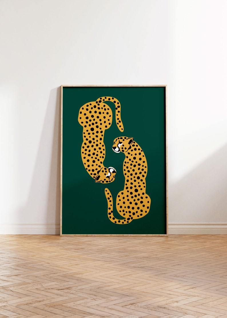 May include: Two stylized cheetahs in a yellow and black pattern are facing each other on a dark green background. The cheetahs are outlined in black and have a simple, graphic design.
