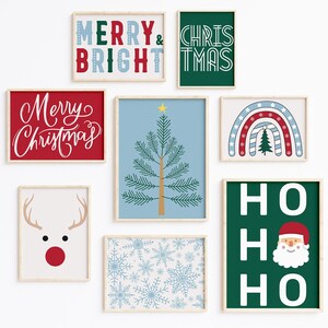 May include: A set of nine framed Christmas prints featuring various holiday themes, including a Christmas tree, a reindeer, snowflakes, a rainbow, and the text "Merry & Bright", "Christmas", and "Ho Ho Ho".