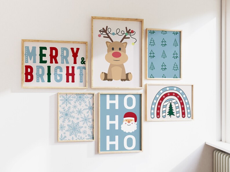 May include: A set of six framed prints with a Christmas theme. The prints feature a reindeer, a snowman, a Christmas tree, a snowflake pattern, and the words "Merry & Bright" and "Ho Ho Ho".