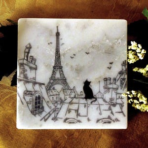 Rooftops of Paris Cat and Eiffel Tower Coaster Sets on Calacatta Marble