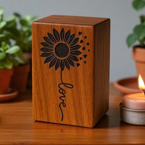 Sunflower love urn with candlelight and potted plants - peaceful setting