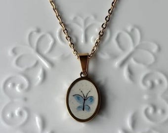 Collana Heartland di Butterfly International / Porcellana rotta / Animali da fattoria