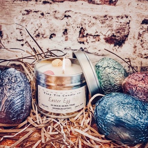 Homemade Candle Easter Egg Scented candle 100ml tin silver tin with easter egg label in black and white surrounded by easter eggs. The perfect easter gift